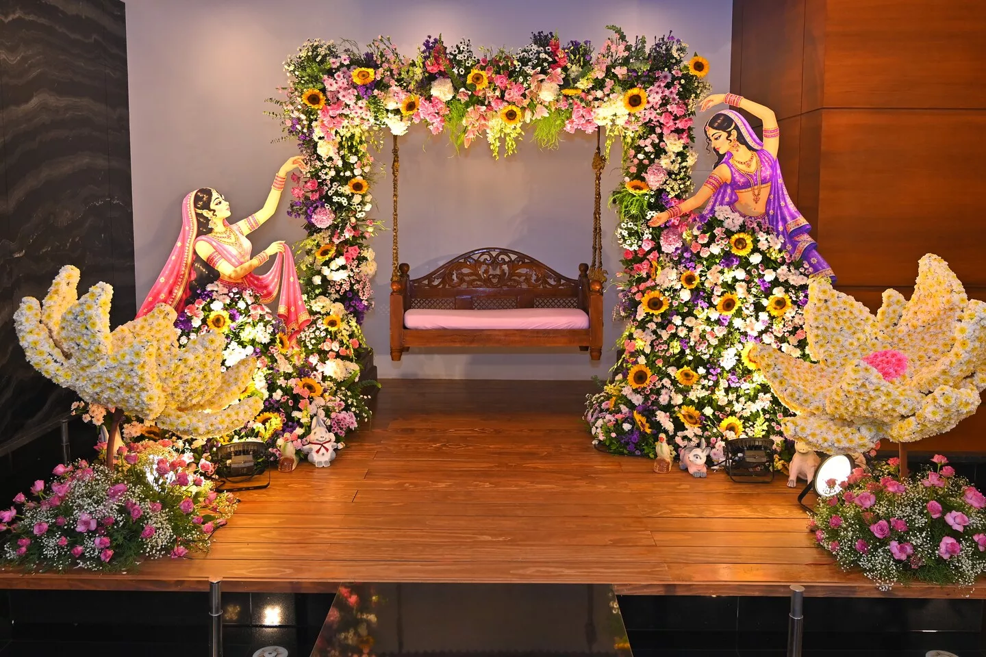 Floral Jhula Decoration with Sunflowers & Giant Flower Sculptures Event Stage Decor Idea
